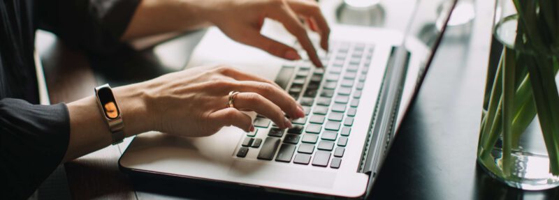 Ladies hands typing on laptop